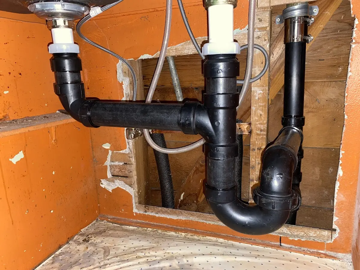 Professional Garbage Disposal Repair equipment and tools on the job in Manchester